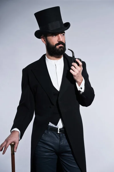 Retro hipster 1900 fashion man with black hair and beard. Wearin — Stock Photo, Image