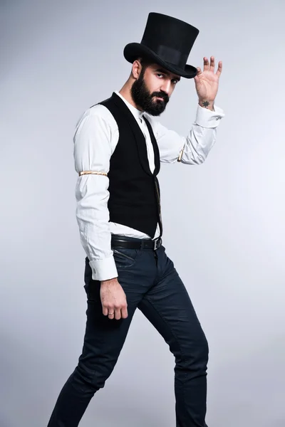 Retro hipster 1900 fashion man with black hair and beard. Wearin — Stock Photo, Image