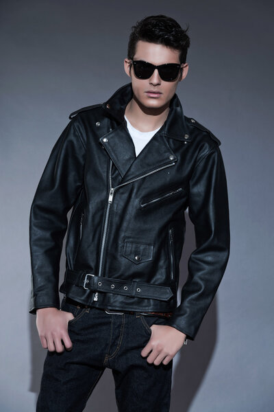 Macho retro rock and roll fifties fashion man with dark grease h