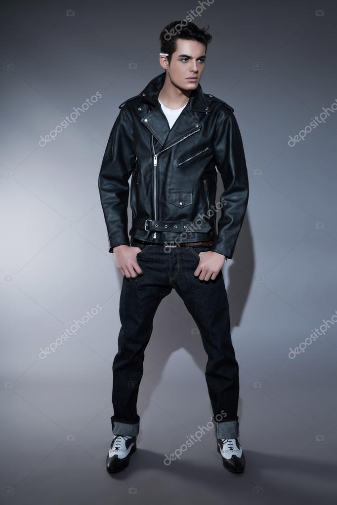 Retro rock and roll 50s fashion man with dark grease hair. Cigar Stock  Photo by ©ysbrand 39267081