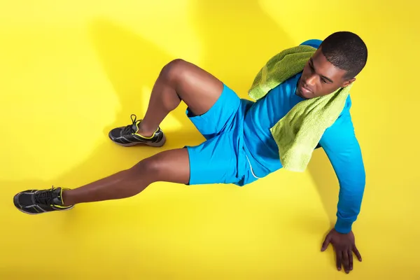 Athletic black man in sportswear fashion. Runner with towel. Int — Stock Photo, Image