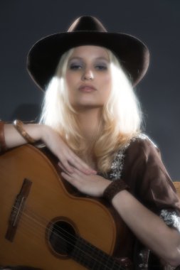 Retro soft focus hippie 70s country guitar girl with long blonde clipart