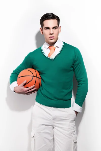 Retro basketball fashion man wearing a green sweater orange tie — Stock Photo, Image