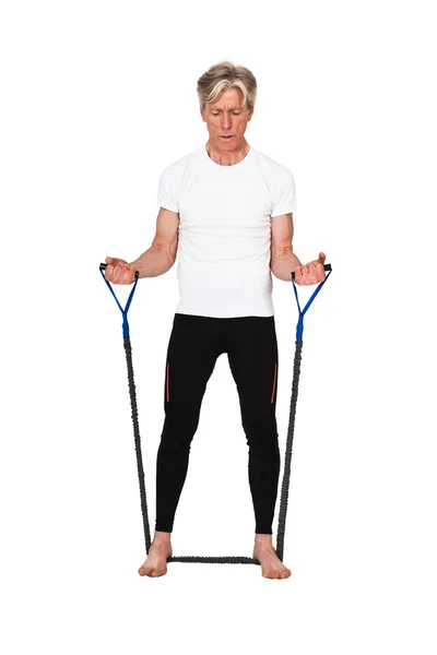 Senior fitness man exercising with blue elastics. Isolated on wh — Stock Photo, Image