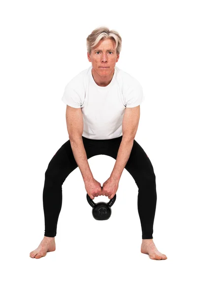 Senior fitness man exercising with weight. Isolated on white. — Stock Photo, Image