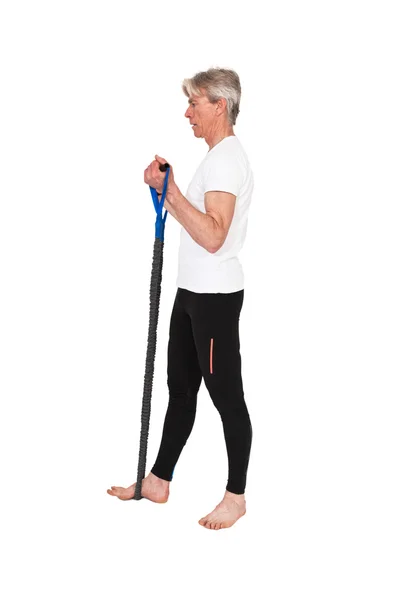 Senior fitness man exercising with blue elastics. Isolated on wh — Stock Photo, Image