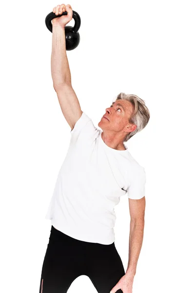 Senior fitness man exercising with weight. Isolated on white. — Stock Photo, Image