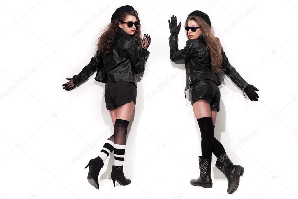 Two bold eighties fashion girls with sunglasses in black and whi