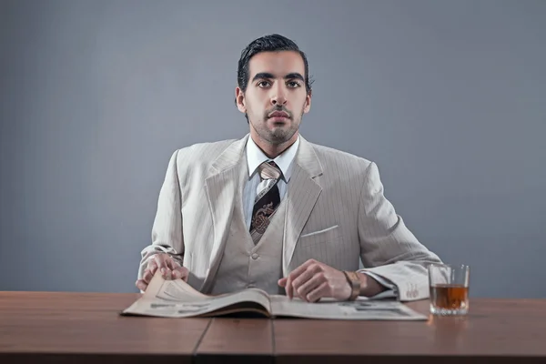 Mafia fashion man wearing white striped suit and tie. Sitting at — Stock Photo, Image