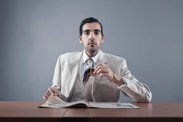 Mafia fashion man wearing white striped suit and tie. Sitting at — Stock Photo, Image