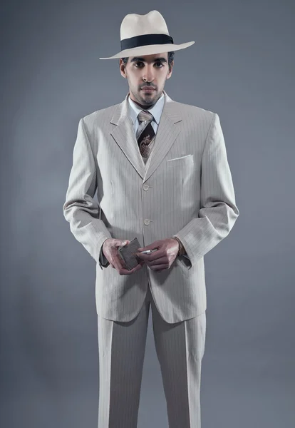 Mafia fashion man wearing white striped suit and hat. Holding vi — Stock Photo, Image