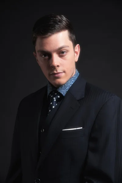 Stylish young business man wearing dark blue jacket and tie. Stu — Stock Photo, Image