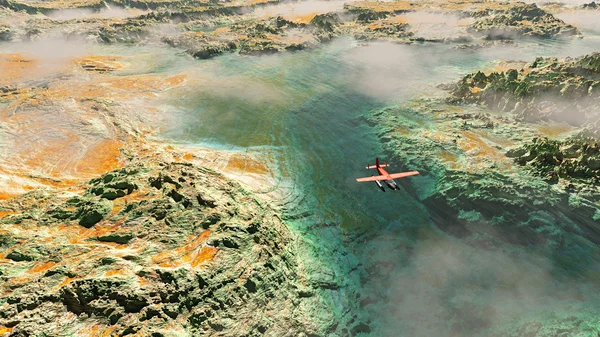 Letecká červené letadlo letící nad skalnaté krajině s řekou — Stockfoto