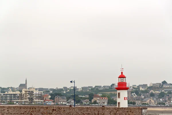Harbor of Erquy with lighthouse and cloudy sky. Brittany. France — Stock Photo, Image