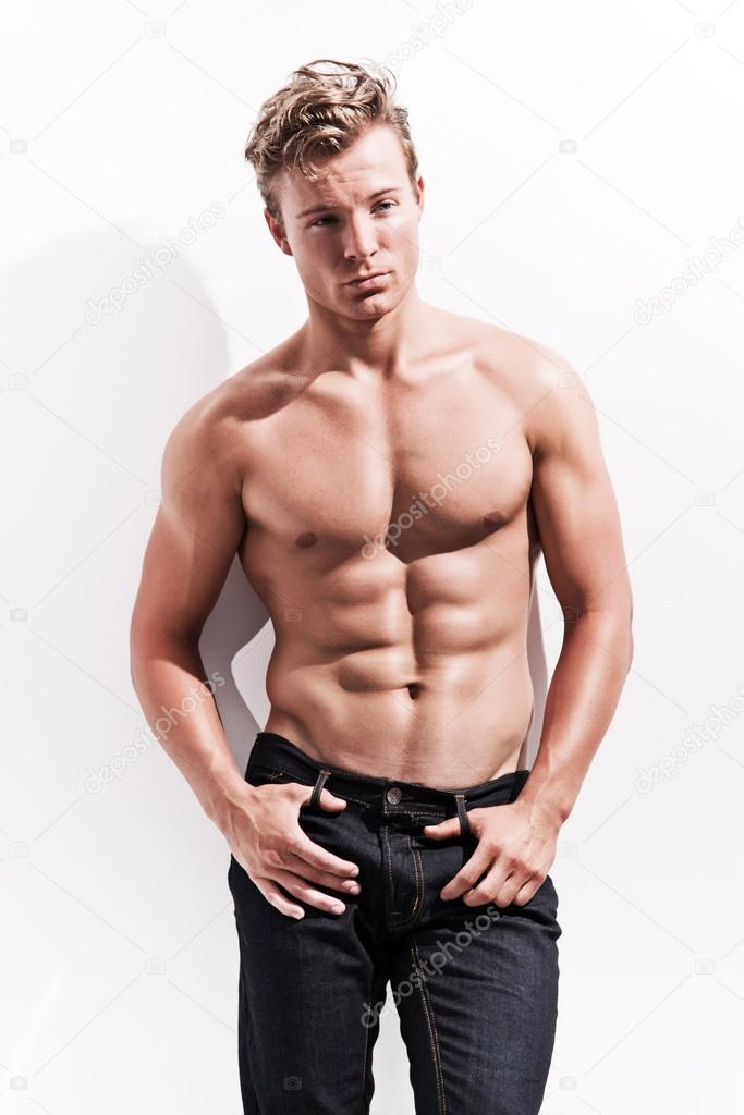 Male fitness model wearing blue jeans. Blonde hair. Against whit Stock Photo by ©ysbrand 51428565 Male fitness model wearing blue jeans. Blonde hair. Against whit Stock Photo by ©ysbrand 51428565