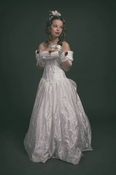 Victorian fashion woman wearing white dress. Holding porcelain t — Stock Photo, Image