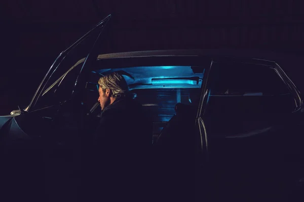 Man Blond Hair Sits American Classic Muscle Car Night — Stock Photo, Image