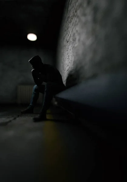 Man Hoodie Sits Bench Dark Prison Render — Fotografia de Stock