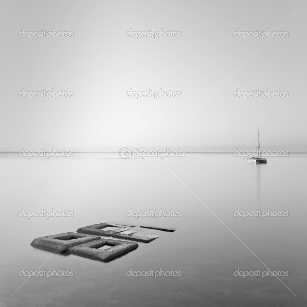 Black & White minimalist seascape with rocks & ship