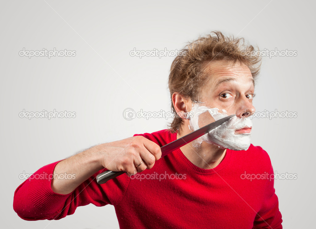 Man shaving with a large kitchen knife