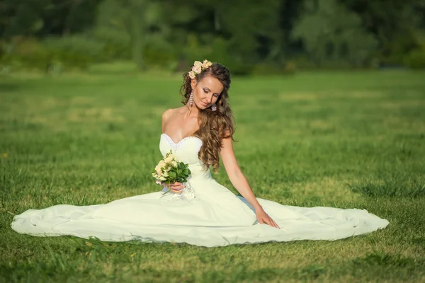 Beautiful woman outdoors in a glade — Stock Photo, Image