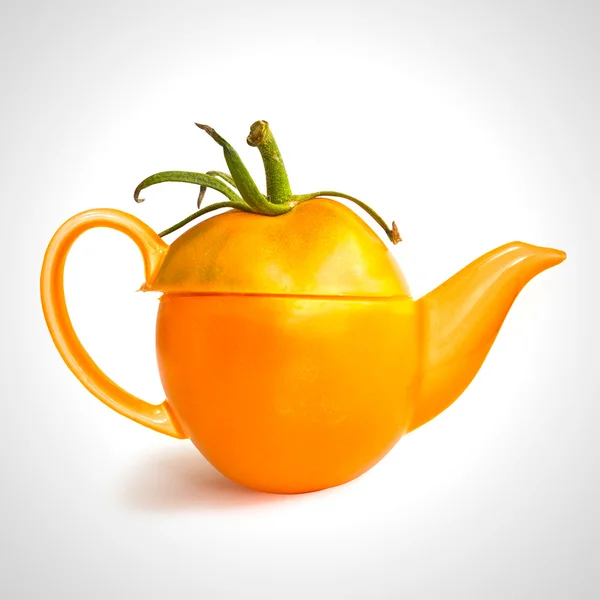 Concept yellow tomato teapot — Stock Photo, Image