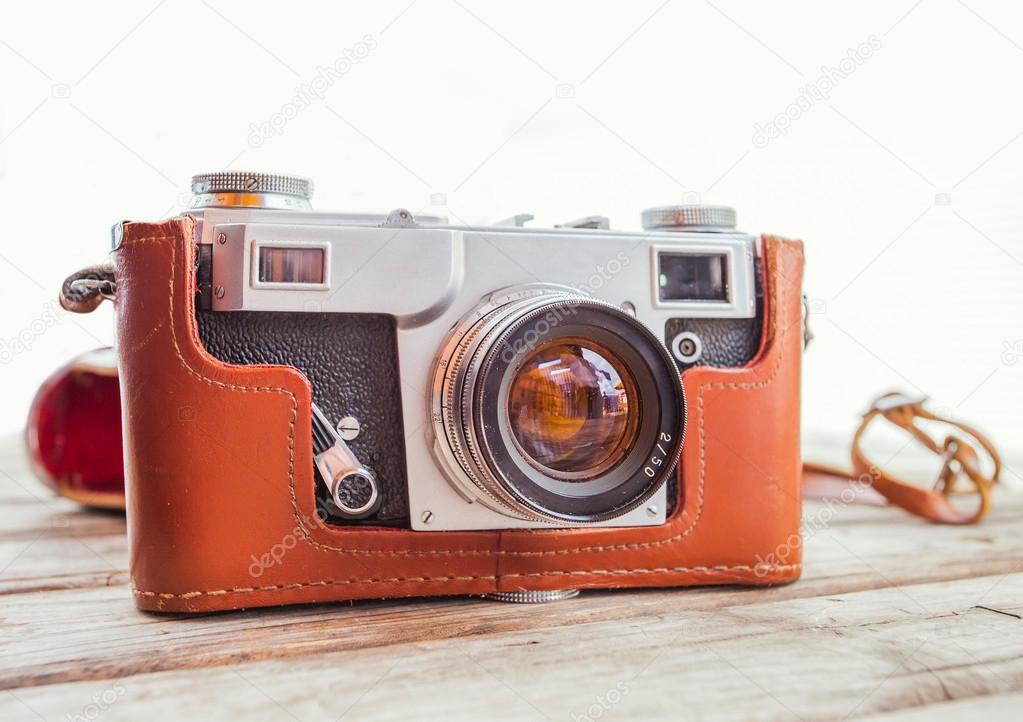 Vintage old camera on wooden table