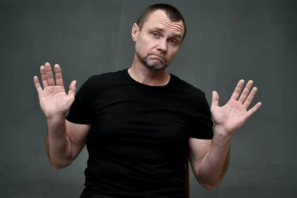 Portrait of an adult man with emotion hands shows no — Stok fotoğraf