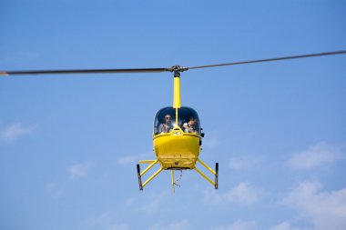 Helicopter in flight clipart