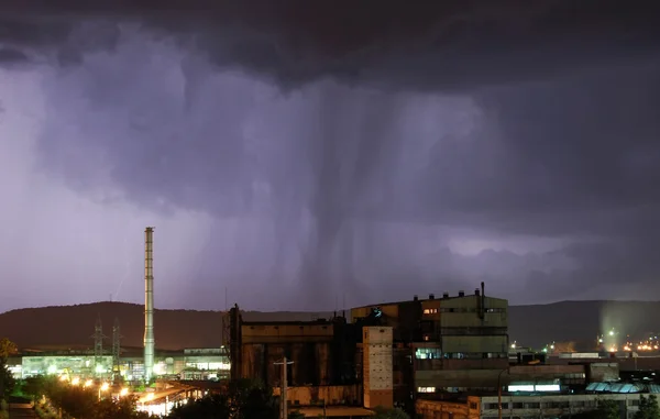 Industrial landscape with heavy storm at night — Stock Photo, Image