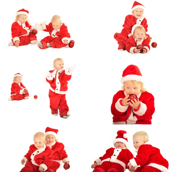 Two fanny kids in santa clauss costumes isolated on white — Stock Photo, Image