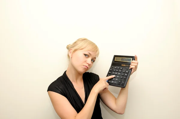 Young business woman with calculator — Stock Photo, Image