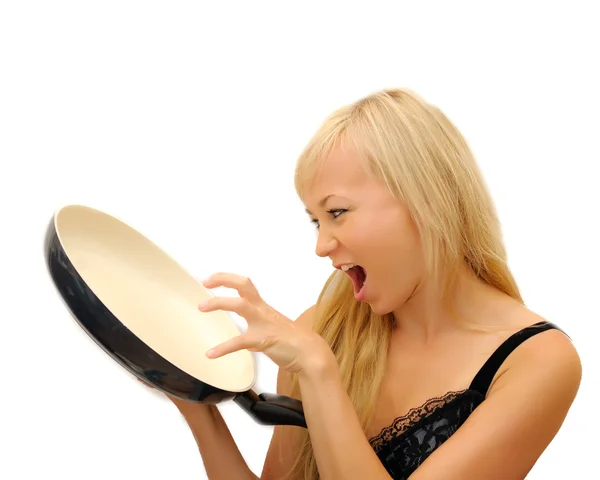 Young beautiful woman with a frying pan isolated on white background. Waiti — Stock Photo, Image