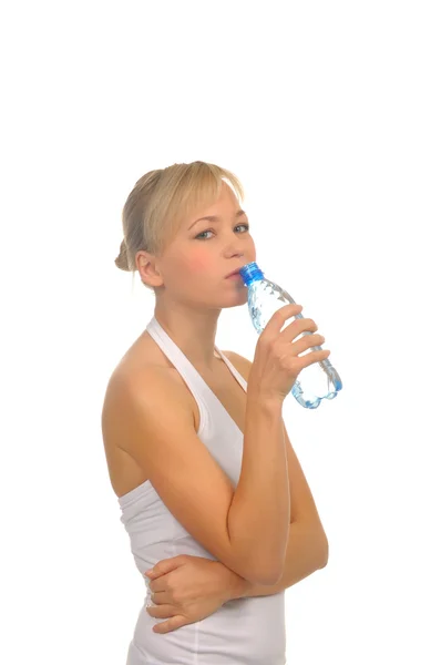 Beautiful woman with bottle of water over white — Stock Photo, Image