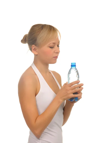 Beautiful woman with bottle of water over white — Stock Photo, Image