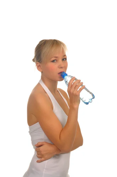 Beautiful woman with bottle of water over white — Stock Photo, Image