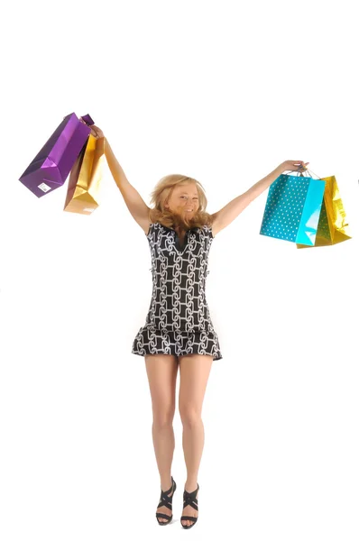 Mulher bonita com um monte de sacos de compras. isolado em branco — Fotografia de Stock