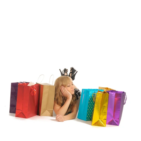 Beautiful woman with a lot of shopping bags. isolated on white — Stock Photo, Image