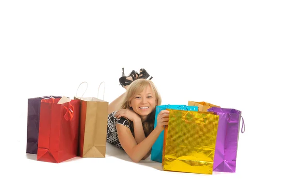 Piękna kobieta z dużą ilością torby na zakupy. na białym tle — Zdjęcie stockowe
