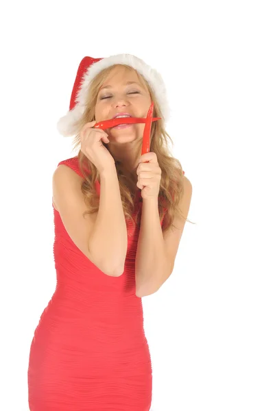 Attractive young woman in Santa Cap with chili pepper. isolated on white — Stock Photo, Image