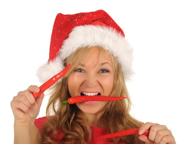 Attractive young woman in Santa Cap with chili pepper. isolated on white — Stock Photo, Image