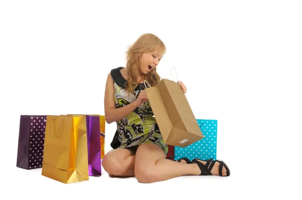 Hermosa mujer con un montón de bolsas de compras. aislado en blanco —  Fotos de Stock