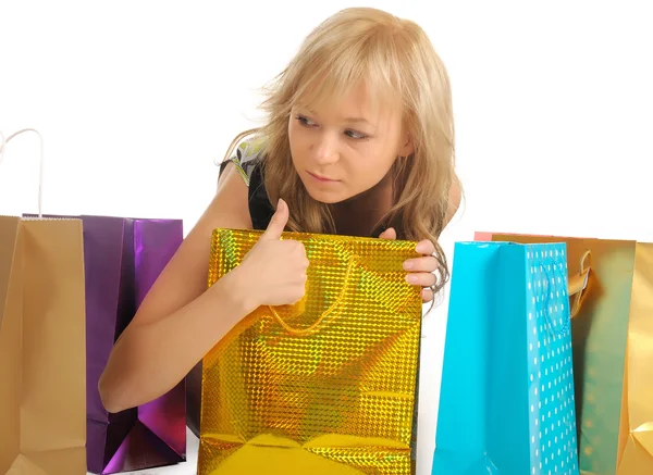 Krásná žena se spoustou nákupních tašek. izolované na bílém — Stock fotografie