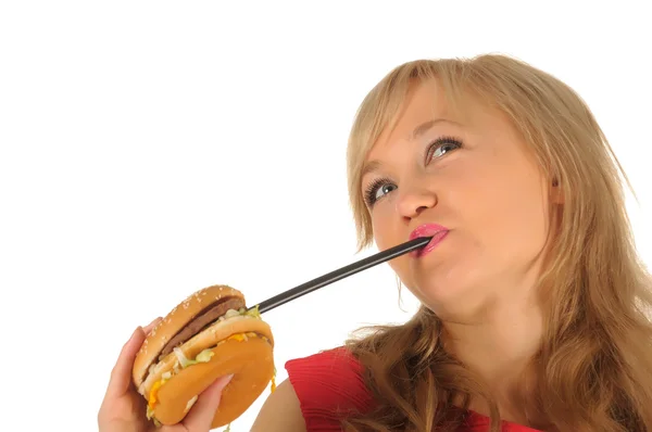 Fiatal vonzó womanin egy piros ruhában, a hamburger. elszigetelt fehér — Stock Fotó