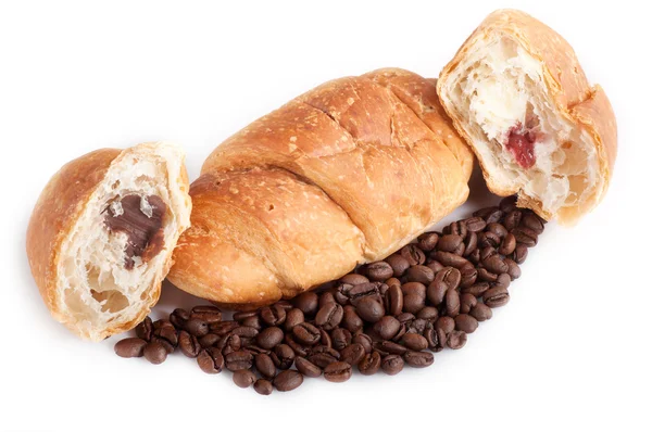 Croissant with coffe beans on white background — Stock Photo, Image