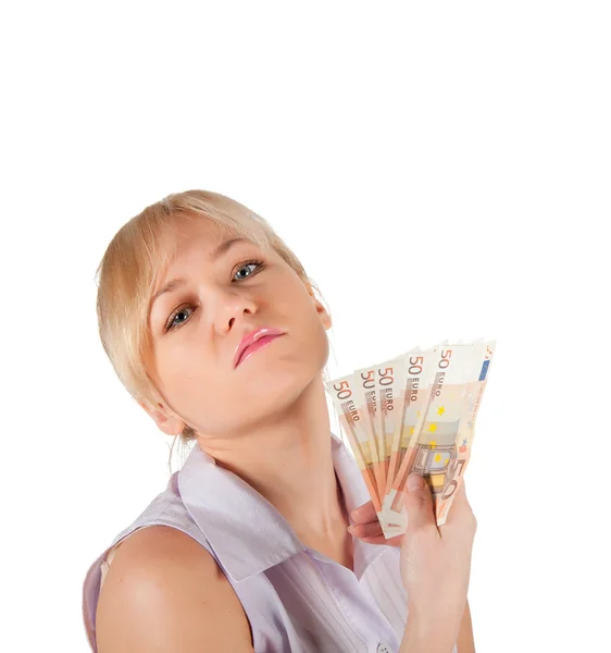 Mujer joven sosteniendo dinero en euros sobre un fondo blanco — Foto de Stock