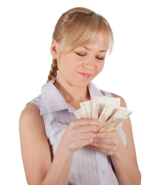 Молода жінка тримає євро гроші на білому тлі — стокове фото
