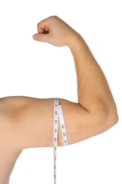 Man arm med måttband runt biceps över vit bakgrund — Stockfoto