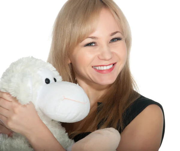 Happy woman with toy sheep over white — Stock Photo, Image