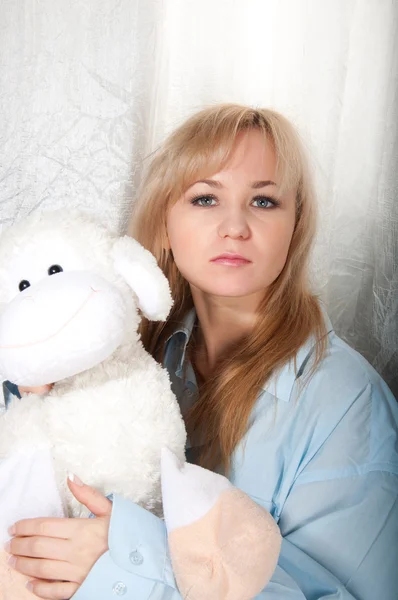 Woman in man shirt with toy sheep — Stock Photo, Image